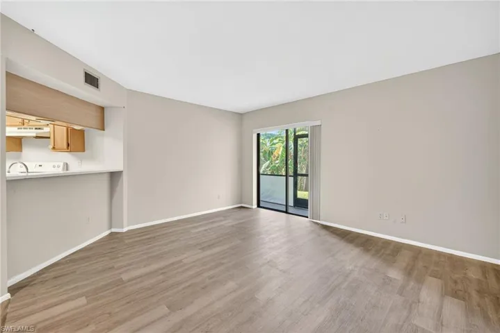 Unfurnished living room featuring light wood finished floors