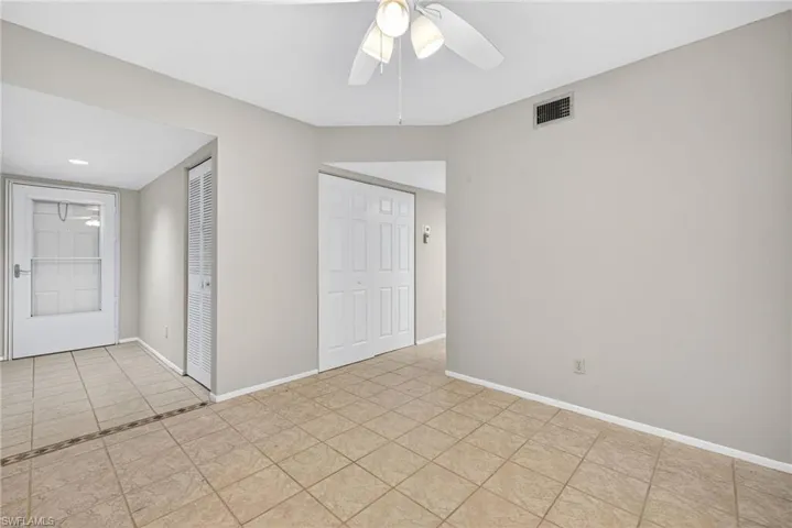 Spare room featuring light tile patterned floors, a ceiling fan, and recessed lighting