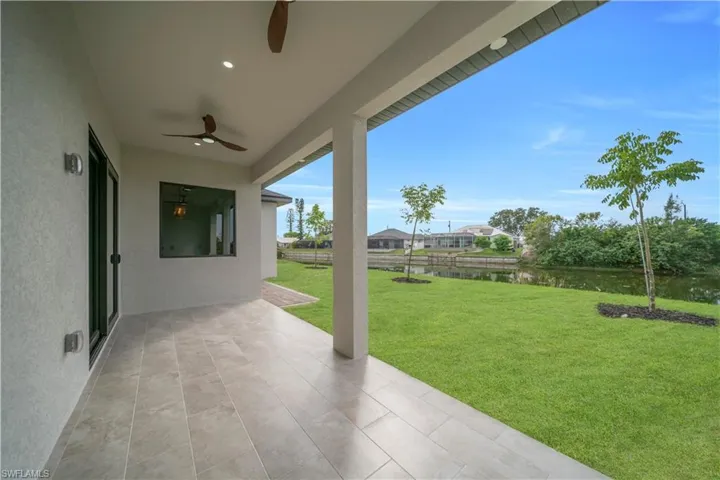 View of patio / terrace featuring a water view and a ceiling fan