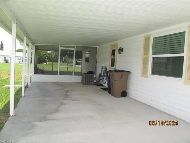 Carport and screened Florida Room