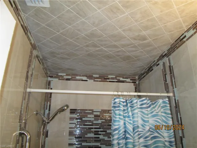 Floor to ceiling tile in bath