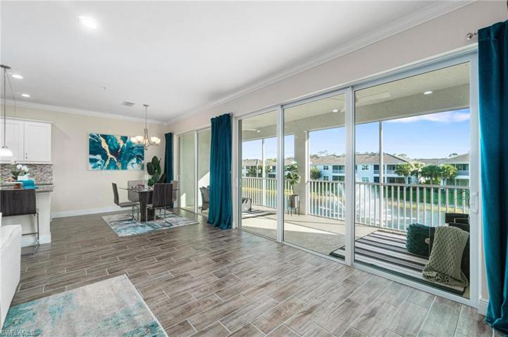 Showcasing the lanai and the long lake views with the central water feature.