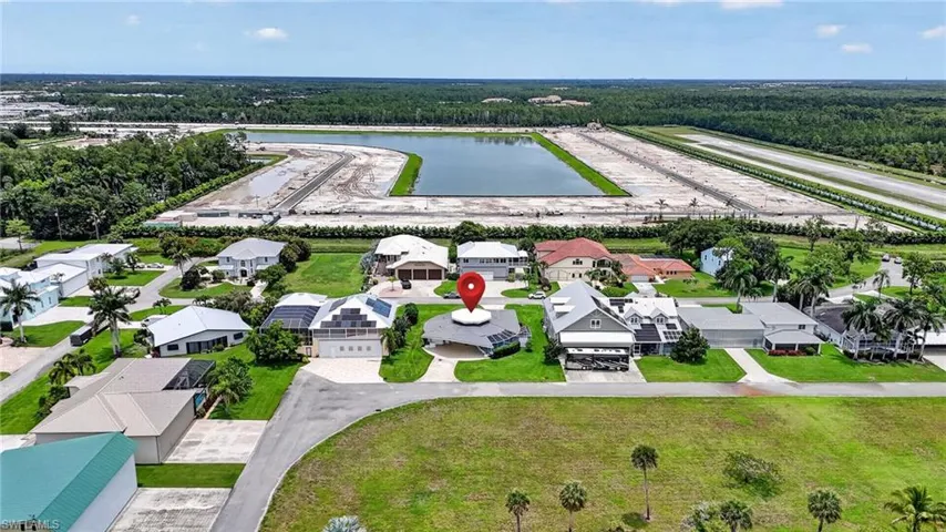 Aerial perspective highlighting a residential street with diverse home styles with nearby new single family home  community pre-construction . Not connected to Wing South.