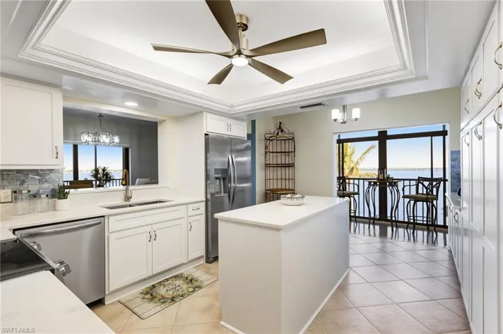 Quartz countertops and gorgeous subway tile that captures the sunlight