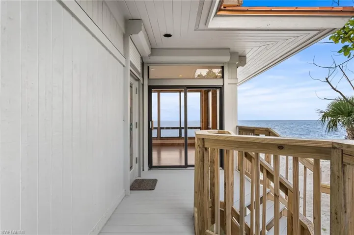 View of exterior entry with a water view