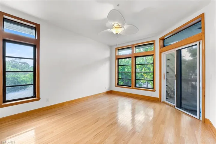 Bedroom featuring plenty of natural light, light wood-style flooring, and ceiling fan