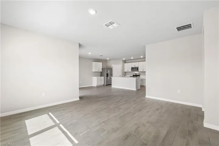 Unfurnished living room featuring light hardwood / wood-style floors