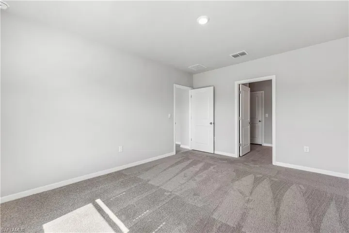 Unfurnished bedroom featuring carpet floors