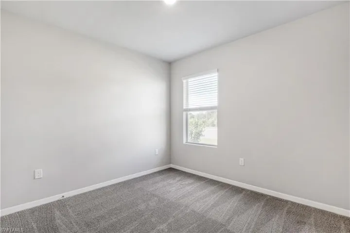 Empty room with carpet flooring