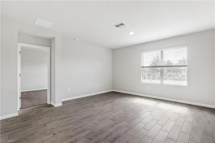 Spare room with light hardwood / wood-style flooring