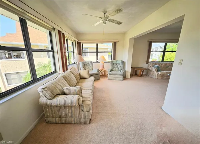 Sunroom / solarium featuring ceiling fan and plenty of natural light
