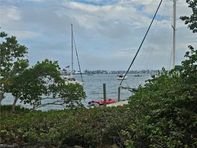 Property view of water featuring a dock
