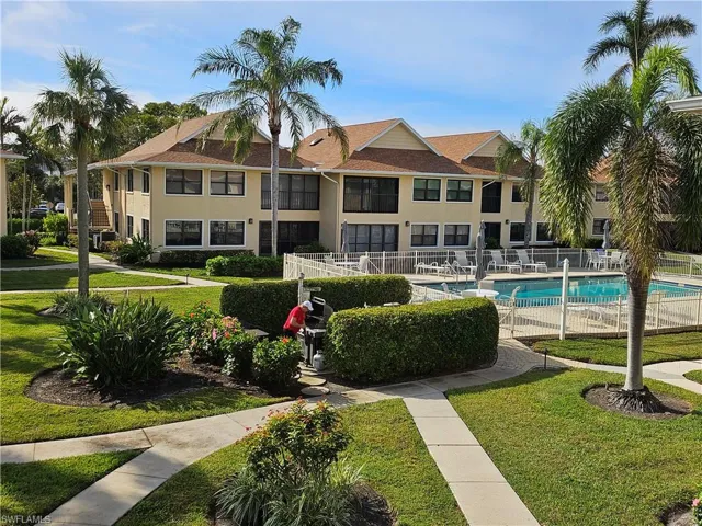 Outside view of pool and grill area