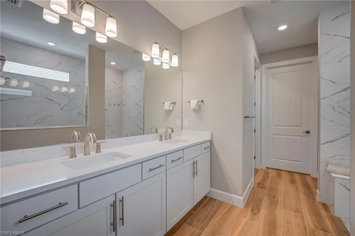Master bath with dual sinks and large walk in shower