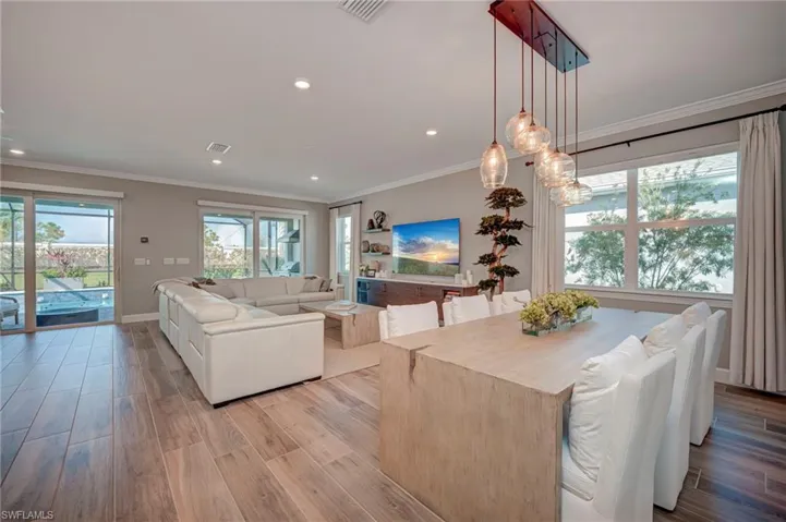 Dining area with great light from the windows and pendant lighting