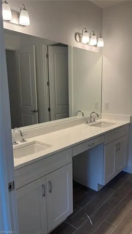 Primary bathroom with dual-sinks and quartz countertops