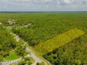 Birds eye view of property featuring a rural view