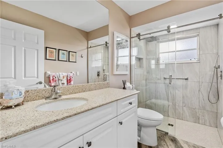 Updated guest bath with brand new shower doors, tile and roll in entry