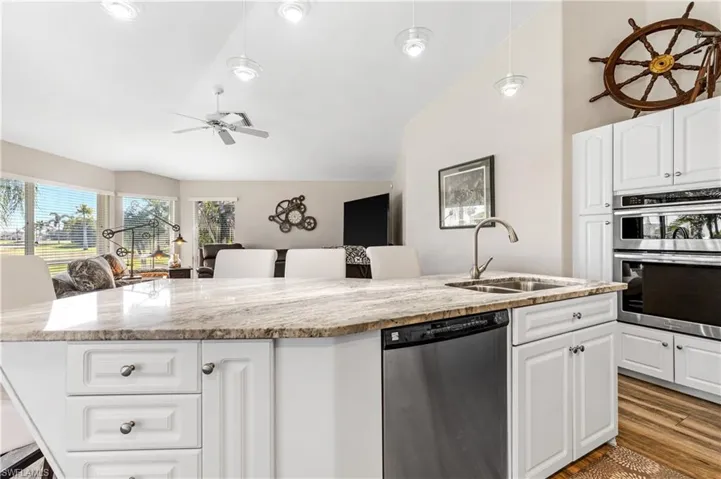 This open kitchen and family room makes it easy to make snacks and watch the game!!