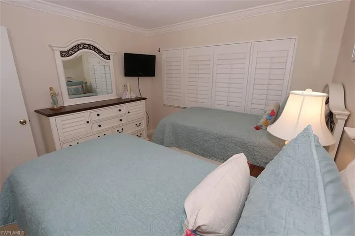 Bedroom featuring ornamental molding