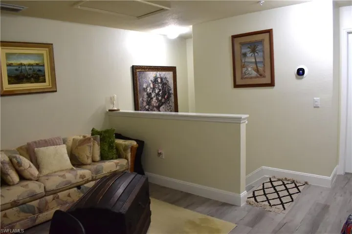 Living area featuring wood finished floors and baseboards