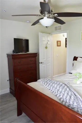 Bedroom featuring a ceiling fan and light wood-type flooring