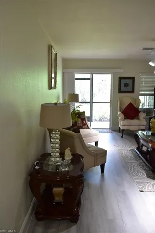 Living room featuring wood finished floors and baseboards