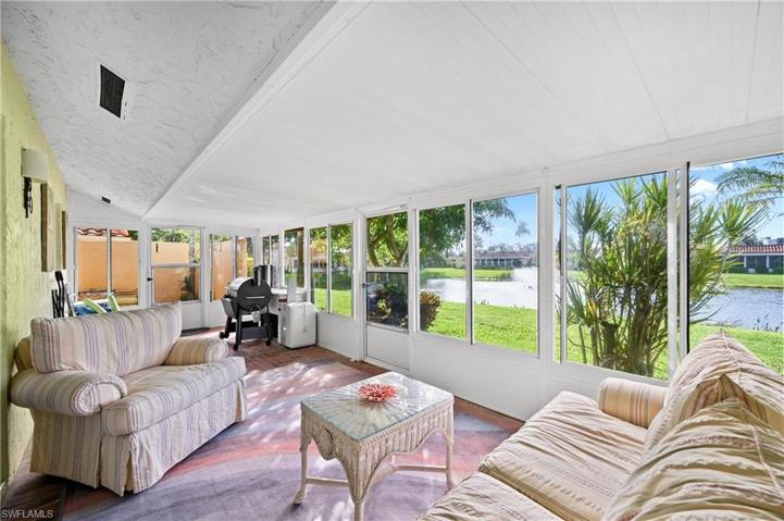 Glass Lanai with water view and sunset