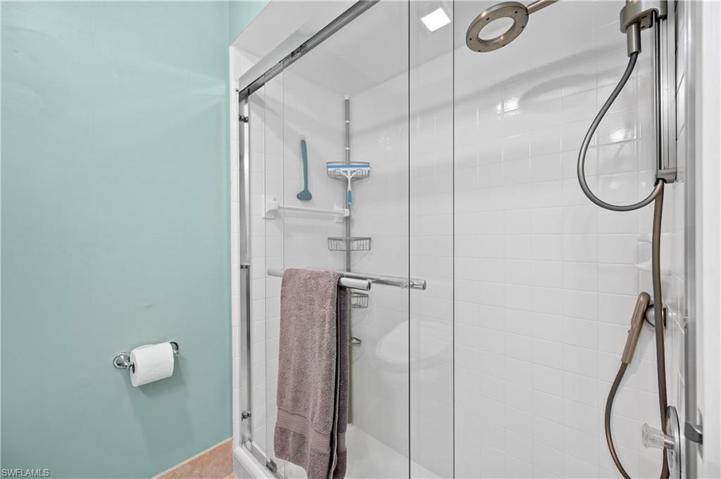 Master shower white tile