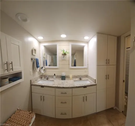 Bathroom featuring double vanity and recessed lighting