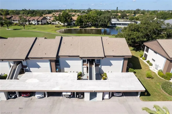 Aerial perspective of condo area featuring a large body of water