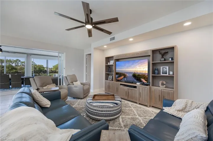 Living area with ceiling fan and recessed lighting