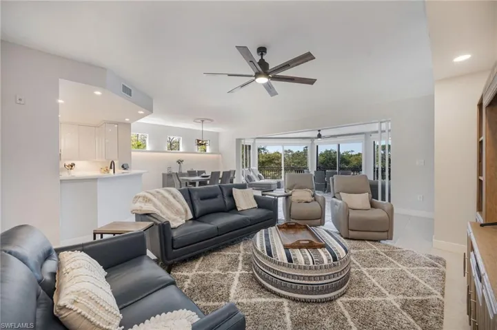 Living room with recessed lighting and ceiling fan