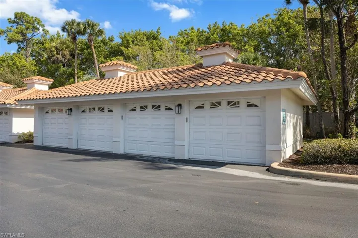 Garage with view of wooded area