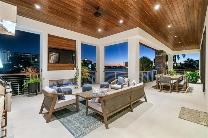 Patio terrace at dusk featuring an outdoor living space
