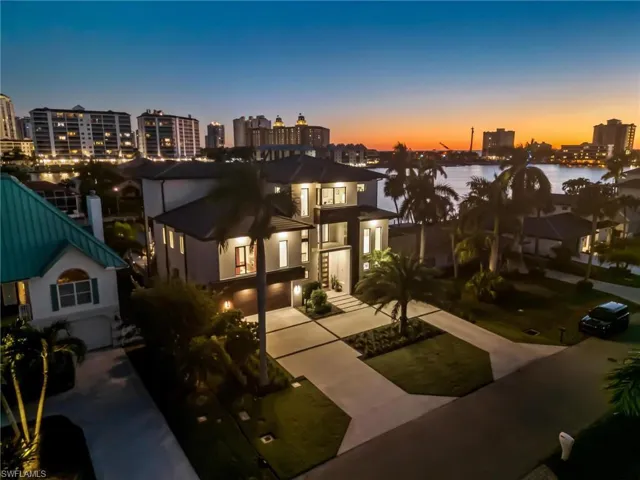 View of front of home with a water view