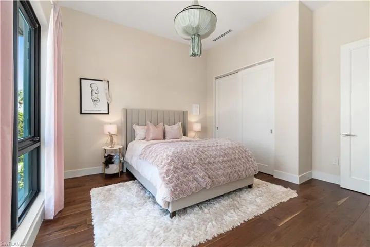 Bedroom featuring dark wood-type flooring
