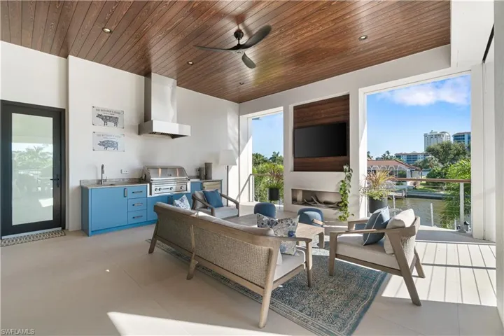 Home office featuring ceiling fan, a healthy amount of sunlight, and light tile patterned floors