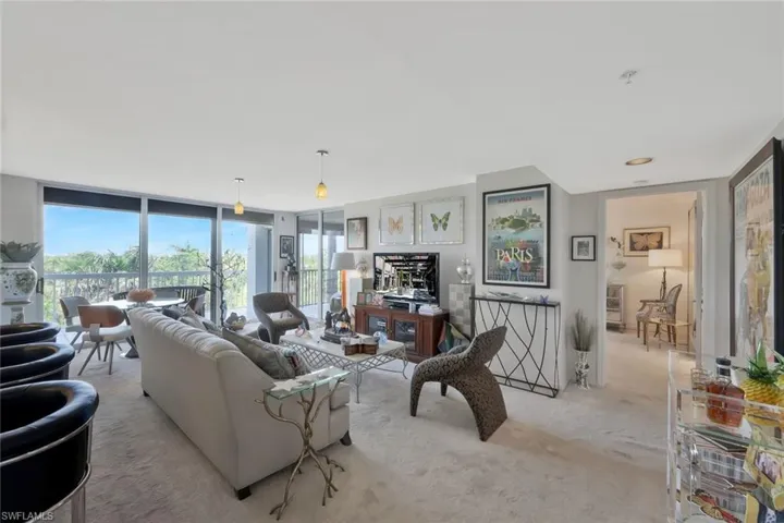 Carpeted living room with expansive windows