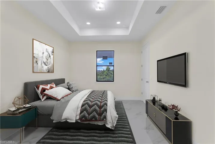 Bedroom with a raised ceiling