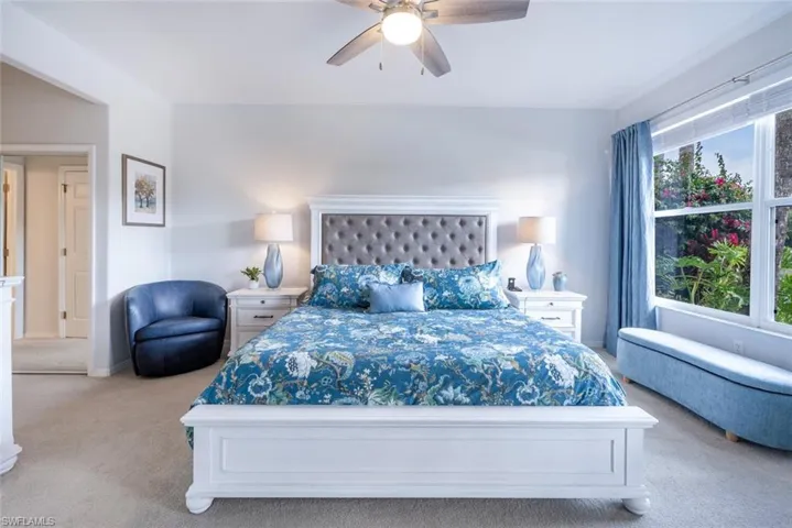 Bedroom with carpet floors and a ceiling fan