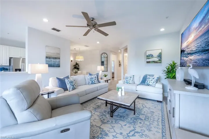 Living room featuring visible vents, a ceiling fan, and recessed lighting