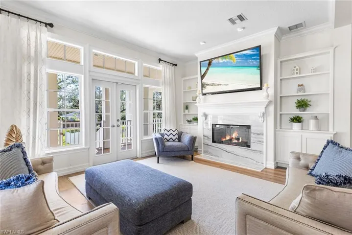 Living area boasts built ins and a gas fireplace.