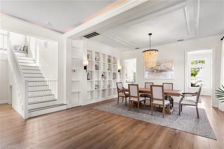 Spectacular built ins in the dining area. Luxury vinyl floors throughout the home. Coffered ceilings, custom lighting!