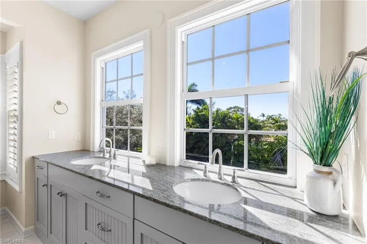 Dual comfort height granite topped vanity. So much natural light!