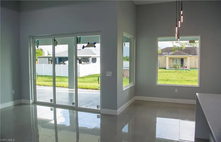 Entryway featuring a healthy amount of sunlight and tile patterned flooring