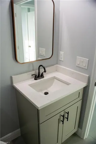 Bathroom with vanity and tile patterned flooring