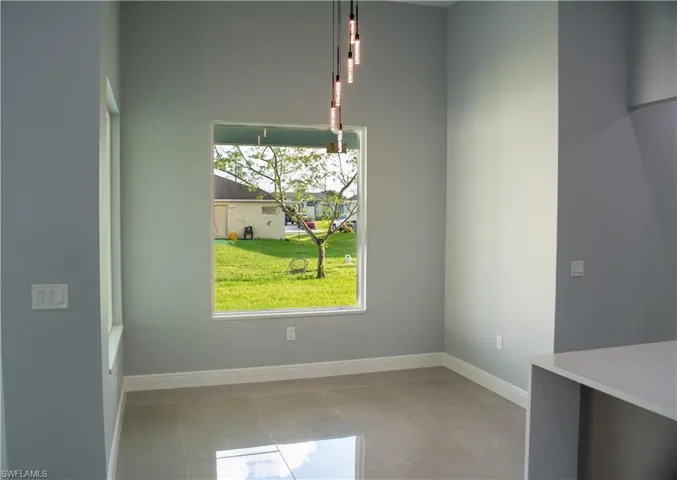 Unfurnished dining area with light tile patterned floors