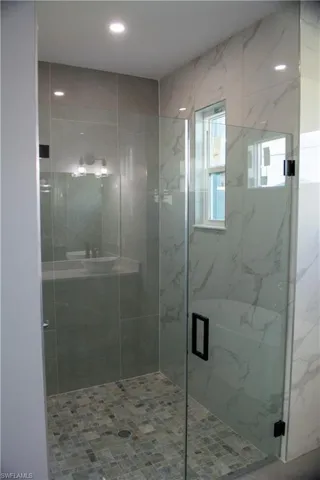 Bathroom featuring a shower with shower door