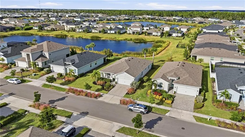 Aerial perspective of suburban area with a nearby body of water